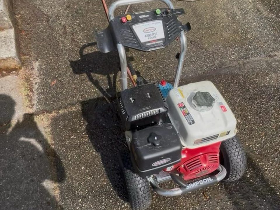ORCA's pressure washing equipment on a driveway